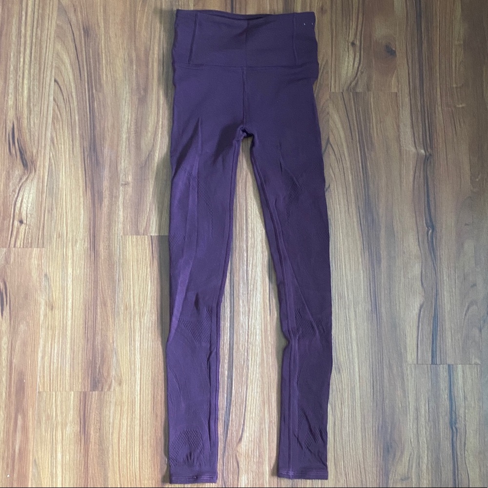 Maroon Lululemon leggings with floral cutouts